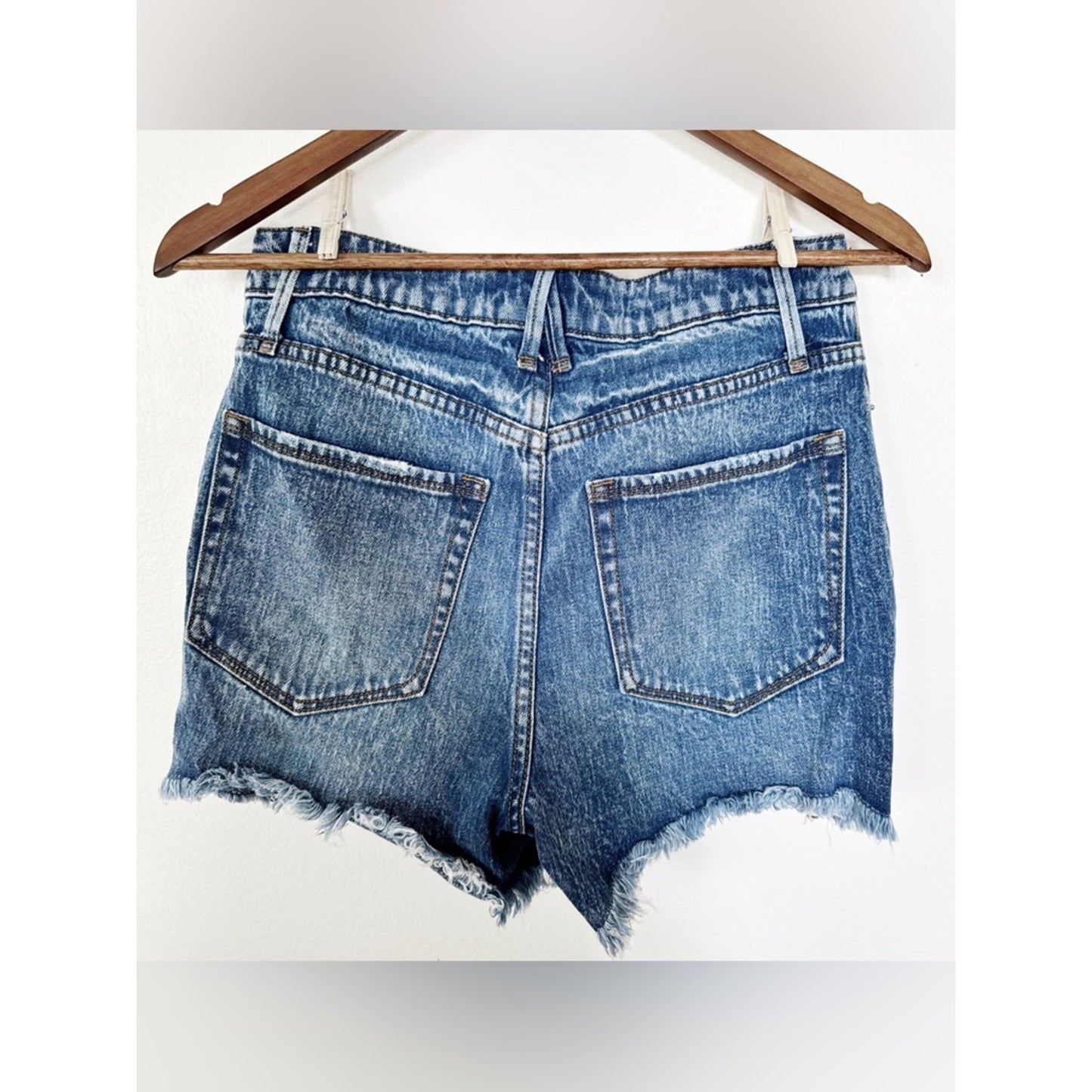 Good American Medium Blue Denim Shorts with Distressed Detailing 4/27
