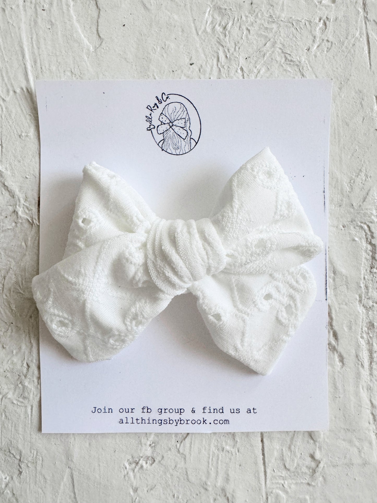 White eyelet pinwheel