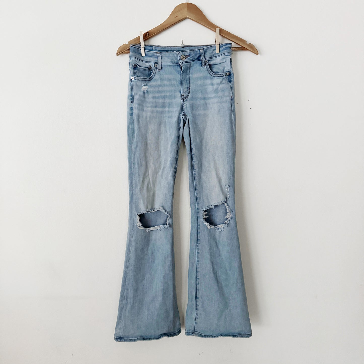 0 | American Eagle Light wash flares knee ripped jeans
